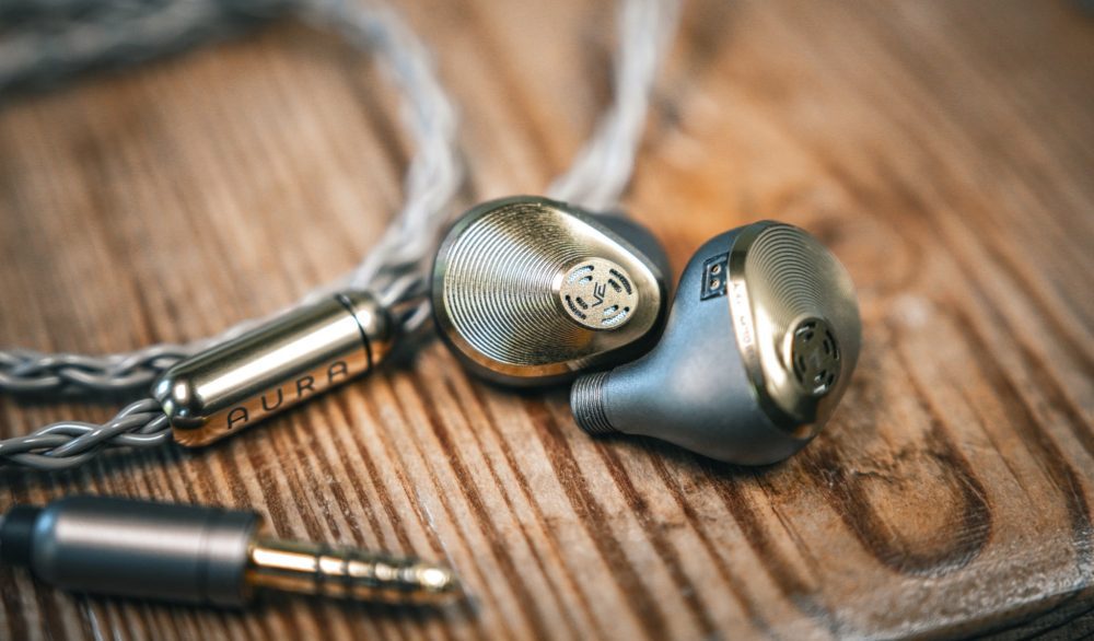 A&K Vision Ears Aura closeup with stock cable on wood table