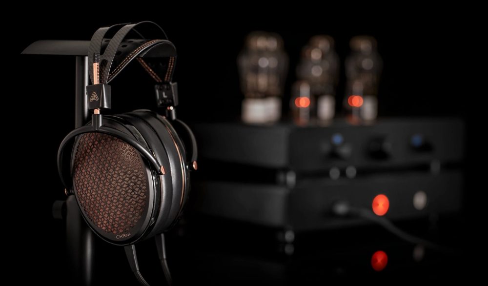 Audeze CRBN2 on headphone stand with amp Bokeh