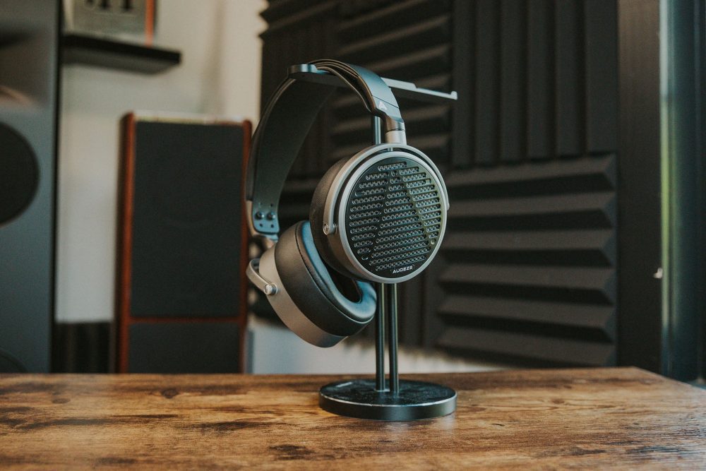 Audeze MM-100 headphone sitting on wooden table