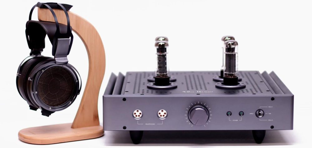 HeadAmp Blue Hawaii SE with detached headphones on wood stand