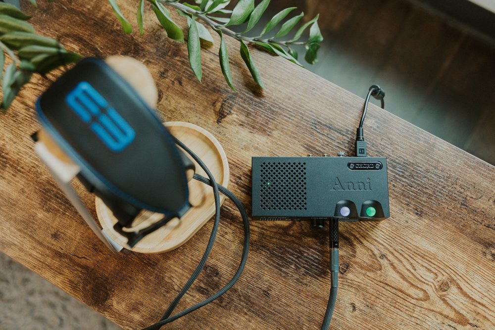 Chord electronics anni amp on wooden table with Dan Clark e3