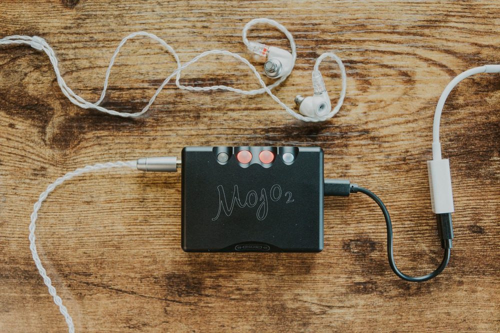 Chord mojo 2 on wooden table with Meze alba iem