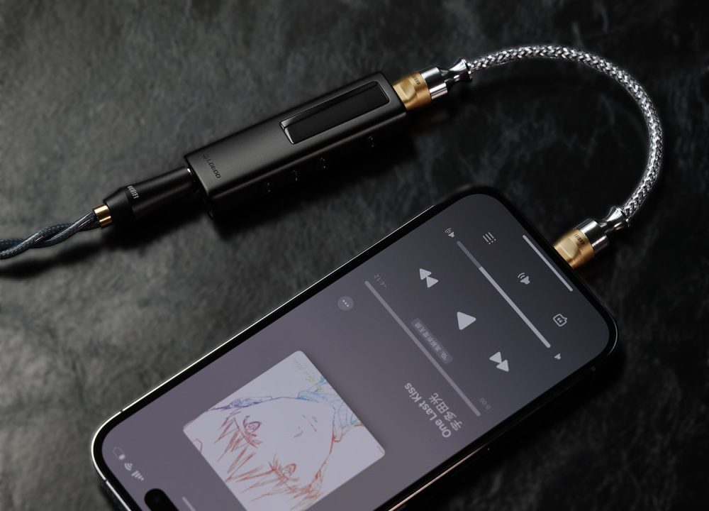 ddHiFi MFi07S cable connected to iPhone with DAC over vinyl background