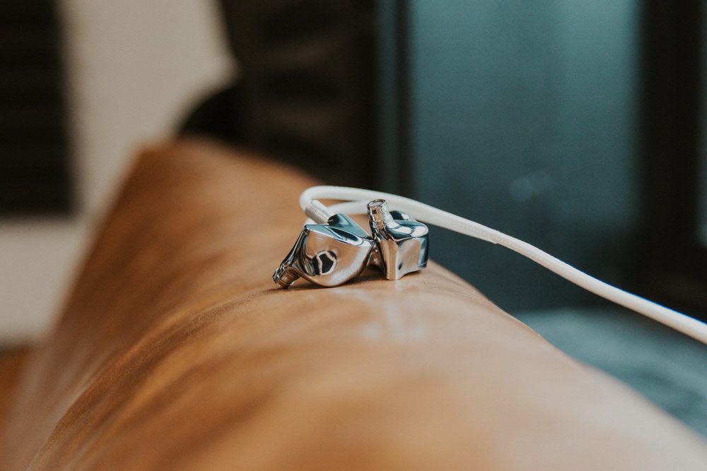 Dunu glacier iem sitting on top of leather couch