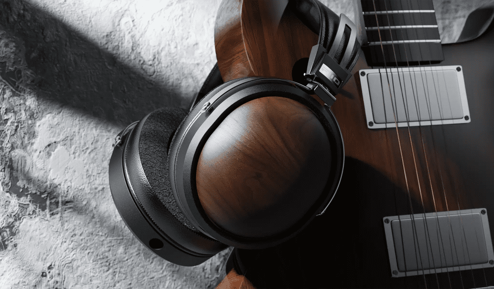 FiiO FT1 headphones hanging on edge of guitar