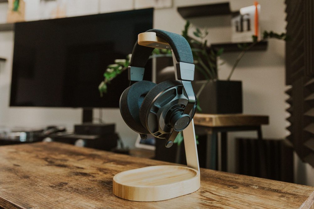 final audio d7000 headphone resting on wooden headphone stand