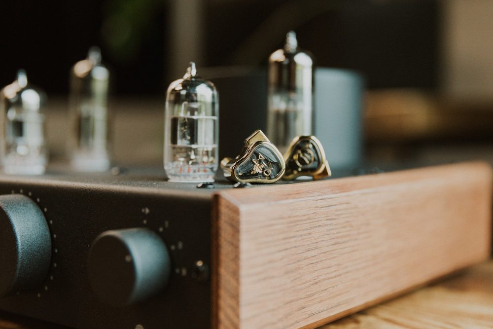 fir audio xenon 6 iem closeup sitting on feliks audio echo mk 2 tube amp