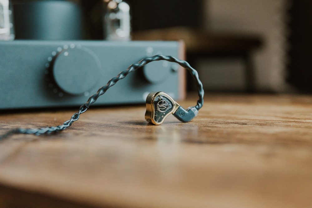 fir audio xenon 6 iem closeup sitting on wooden table