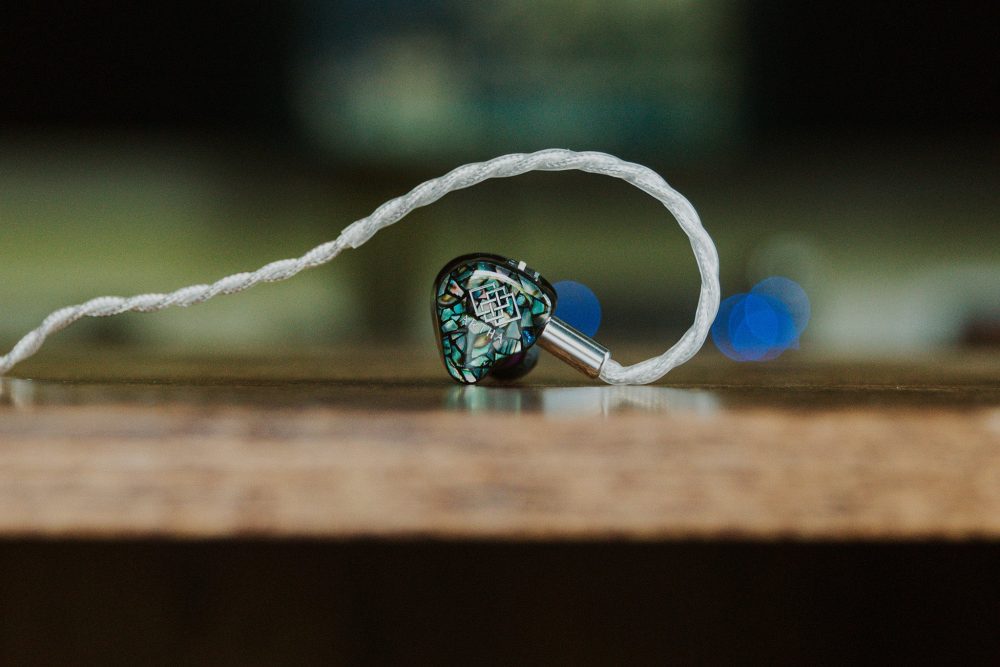 Flipears Artha iem close up sitting on wooden table