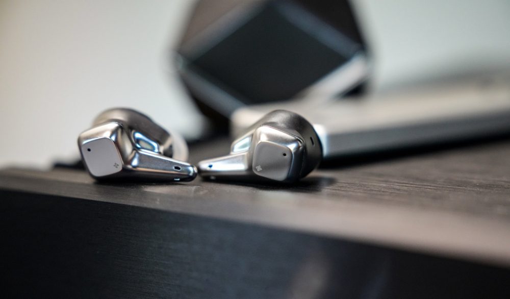 HiFiMAN Svanar Wireless on black table with case in background from Bloom Audio gallery