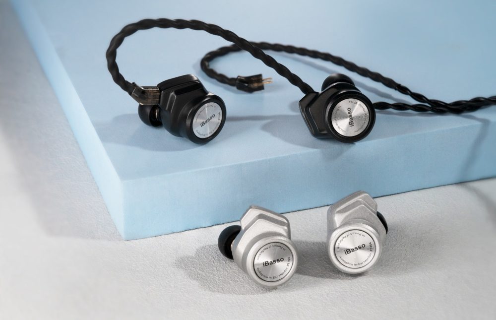 2 sets iBasso 3T-154 earphones in silver and black with attached stock cable on blue board