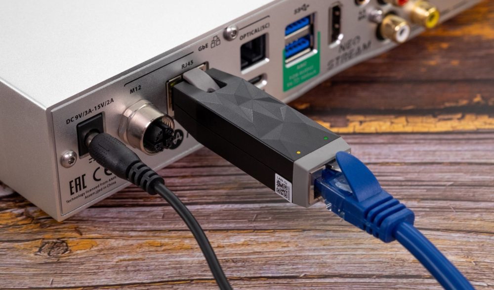 iFi LAN Silencer connected to network streamer on wooden desk