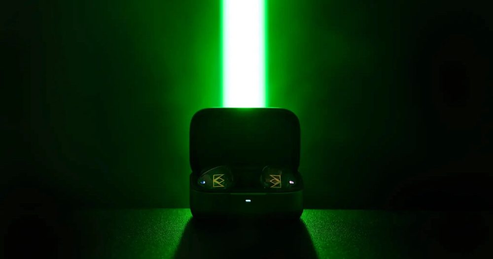 Noble Audio FoKus Rex5 inside open case dark background with centered backlit lightsaber-like green LED