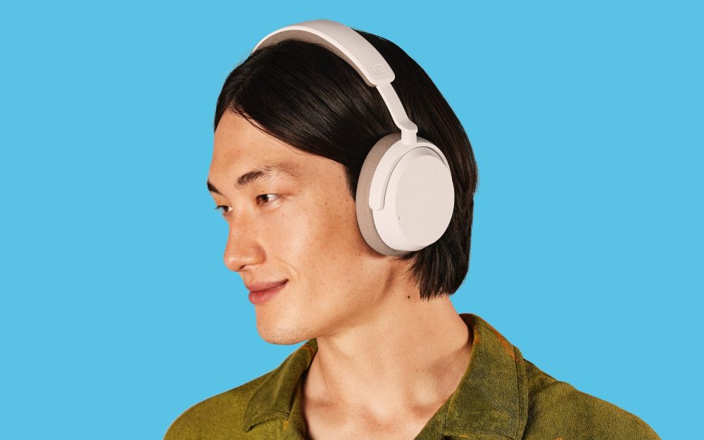 Sennheiser ACCENTUM white profile on human male over turquoise background