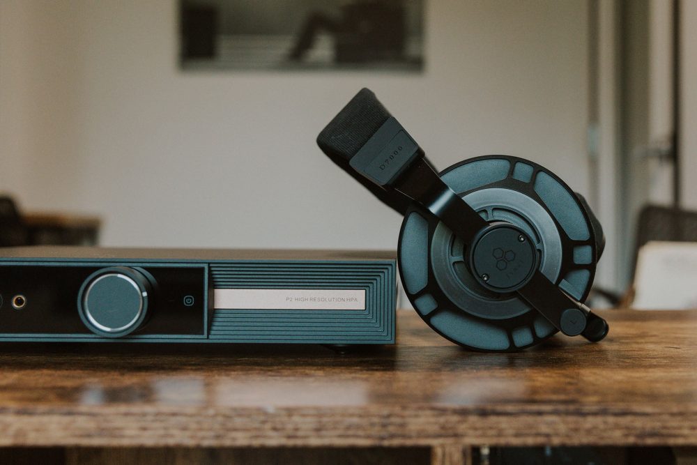 final d7000 headphone closeup resting on smsl desktop amp